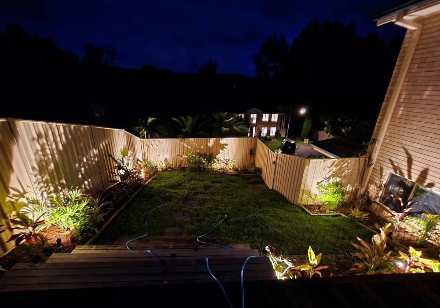 garden makeover after photo at night from flame tree garden care central coast